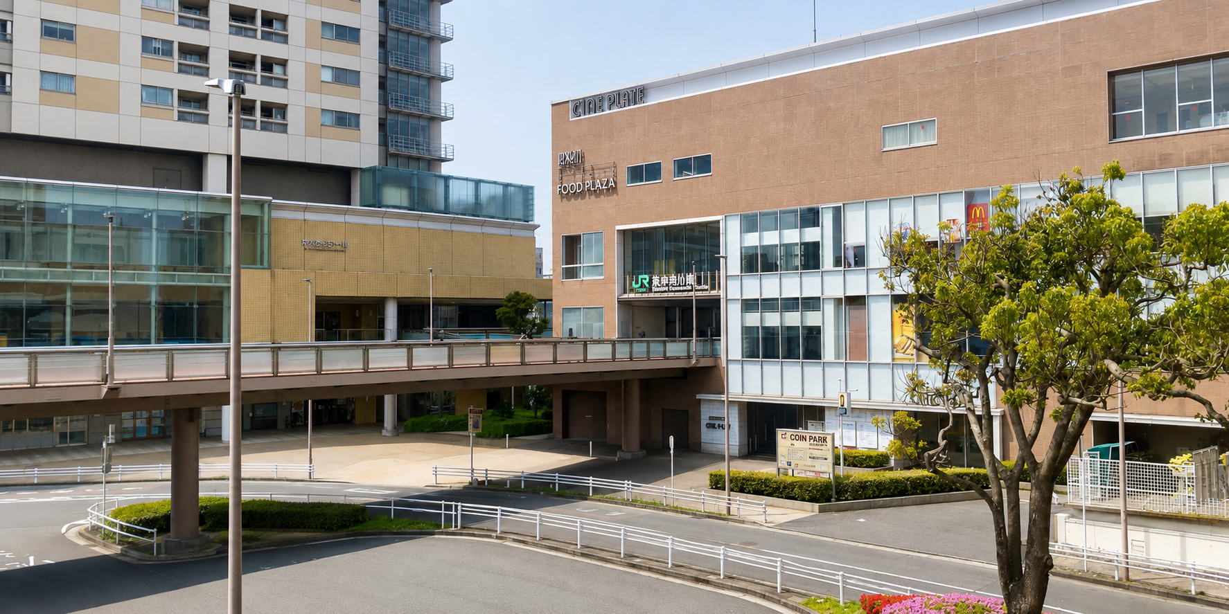 東神奈川駅周辺の明るい昼の街並みを表現したイメージ画像
